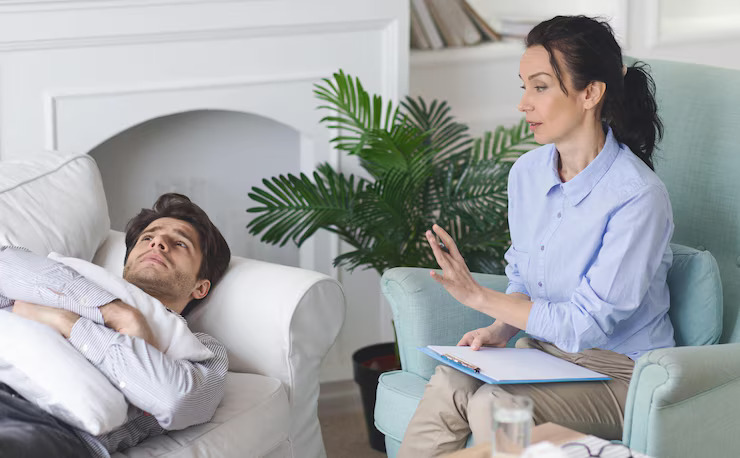 therapist-engages-with-man-patient-lying-sofa-providing-counseling-contemporary-living_116547-123623